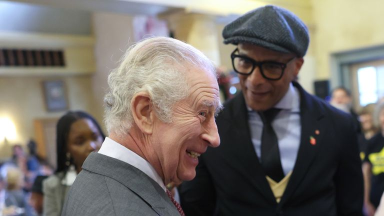 King Charles III talking to Jay Blades (left) during his 75th birthday party at Highgrove Gardens in Tetbury on the eve of his birthday, with community champions who are also celebrating turning 75 in 2023. Picture date: Monday November 13, 2023.